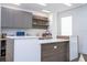 Sleek kitchen with modern cabinetry, a spacious island, and a stylish backsplash at 1781 Pine Ave, Winter Park, FL 32789