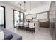 Modern kitchen with a large island, sleek countertops, and stainless steel appliances at 1781 Pine Ave, Winter Park, FL 32789
