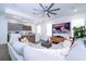 Open-concept living room with modern decor, stylish furnishings, and a large television screen at 1781 Pine Ave, Winter Park, FL 32789