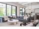 Open concept living room featuring a large sectional sofa, modern furniture, and access to the backyard at 1781 Pine Ave, Winter Park, FL 32789