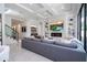 Open living area with modern fireplace, large television, recessed lighting, and large sliding glass doors at 1781 Pine Ave, Winter Park, FL 32789