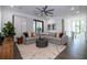 Inviting living room with a sectional sofa, decorative rug, and ample natural light at 1781 Pine Ave, Winter Park, FL 32789