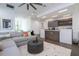 Comfortable living room featuring stylish decor, a large sectional sofa, and an open floor plan at 1781 Pine Ave, Winter Park, FL 32789