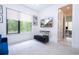 Stylish living room with a large window, keyboard setup, and comfortable seating, perfect for relaxing or entertaining at 1781 Pine Ave, Winter Park, FL 32789
