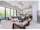 Bright, open-concept living room featuring a large sectional sofa and modern decor near the kitchen at 1781 Pine Ave, Winter Park, FL 32789