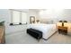Bright bedroom featuring neutral decor, recessed lighting, and a bench at the foot of the bed at 1781 Pine Ave, Winter Park, FL 32789