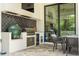 Outdoor kitchen with stylish black tile and dining area at 1781 Pine Ave, Winter Park, FL 32789