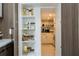Pantry with organized shelving offering ample storage and a view into the bright kitchen at 1781 Pine Ave, Winter Park, FL 32789
