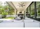 Covered patio featuring a grill, outdoor seating, and a ceiling fan at 1781 Pine Ave, Winter Park, FL 32789
