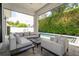 Stylish outdoor patio with comfortable seating, overlooking a refreshing swimming pool at 1781 Pine Ave, Winter Park, FL 32789