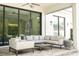 Covered patio with comfy seating and ceiling fans for year-round outdoor living at 1781 Pine Ave, Winter Park, FL 32789