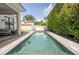 Backyard pool with privacy landscaping and sun-bathing deck at 1781 Pine Ave, Winter Park, FL 32789