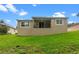 Home exterior shows a well-maintained green backyard and stucco exterior at 1812 Stoneywood Way, Apopka, FL 32712