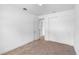 Minimalist bedroom with neutral carpeting, simple closet, and white walls at 1812 Stoneywood Way, Apopka, FL 32712