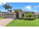 Beautifully landscaped home with neutral exterior and inviting front entrance at 1812 Stoneywood Way, Apopka, FL 32712