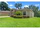 Well-maintained home with lush lawn, manicured landscaping, and neutral color scheme at 1812 Stoneywood Way, Apopka, FL 32712