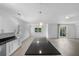 Bright, spacious kitchen and dining area with pendant lighting and tile floors at 1812 Stoneywood Way, Apopka, FL 32712