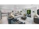 Bright open-concept living room with modern kitchen and dining area, perfect for entertaining at 1812 Stoneywood Way, Apopka, FL 32712
