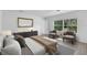 Calming main bedroom offers a tranquil retreat with great light and simple design at 1812 Stoneywood Way, Apopka, FL 32712