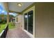 Relax on this covered patio with brick pavers overlooking the fenced yard at 1812 Stoneywood Way, Apopka, FL 32712