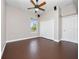 Bright bedroom featuring a ceiling fan, closet, and large window for natural light at 19562 Majestic St, Orlando, FL 32833