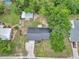 Aerial view of property showcasing the home, outbuildings, and perimeter fencing at 2105 Ne 50Th Pl, Ocala, FL 34479