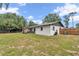 Spacious backyard featuring a covered patio and well maintained yard at 2105 Ne 50Th Pl, Ocala, FL 34479