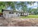 View of backyard featuring a covered patio, dog run, and the back of the house at 2105 Ne 50Th Pl, Ocala, FL 34479