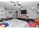 Comfortable bedroom with personal decorations, a ceiling fan, and carpet floors at 2105 Ne 50Th Pl, Ocala, FL 34479
