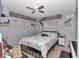 Cozy bedroom with an array of toys and decorative items surrounding a comfortable bed at 2105 Ne 50Th Pl, Ocala, FL 34479