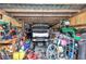Interior view of carport filled with golf cart and other outdoor supplies at 2105 Ne 50Th Pl, Ocala, FL 34479