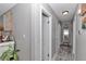 Inviting hallway featuring neutral paint, modern lighting, and elegant decor at 2105 Ne 50Th Pl, Ocala, FL 34479