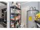 Functional pantry space with shelving, storage, and convenient access to utilities and the adjacent kitchen at 2105 Ne 50Th Pl, Ocala, FL 34479