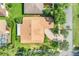 An aerial view of a one story home with beautiful roof, complemented by lush landscaping and a paved driveway at 217 Lake Cassidy Dr, Kissimmee, FL 34759