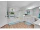 Bright bathroom with a soaking tub, glass shower, and dual vanity with granite countertops at 217 Lake Cassidy Dr, Kissimmee, FL 34759
