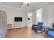 Bedroom features a TV, a comfortable chair, and plenty of space for relaxation at 217 Lake Cassidy Dr, Kissimmee, FL 34759