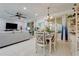 Open-concept dining area featuring modern decor, a ceiling fan, and bright lighting at 217 Lake Cassidy Dr, Kissimmee, FL 34759