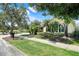 Charming one-story home with lush landscaping, mature trees, and a sidewalk at 217 Lake Cassidy Dr, Kissimmee, FL 34759