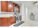Cherry cabinets and stainless steel appliances in this well-equipped kitchen at 217 Lake Cassidy Dr, Kissimmee, FL 34759