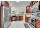 Spacious kitchen with stainless steel appliances, granite counters, and abundant cabinet space at 217 Lake Cassidy Dr, Kissimmee, FL 34759