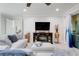 Bright living room features stylish furniture, tile floors, and a cozy fireplace at 217 Lake Cassidy Dr, Kissimmee, FL 34759