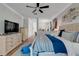 Comfortable main bedroom with a cozy rug, ceiling fan, and stylish decor at 217 Lake Cassidy Dr, Kissimmee, FL 34759