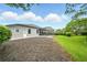 Charming home showcasing a spacious backyard with a screened-in patio, perfect for entertaining at 2308 Bur Oak Ct, Oviedo, FL 32766