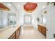 Large bathroom with dual sinks, granite counters, corner tub and shower, plus a unique ceiling detail at 2308 Bur Oak Ct, Oviedo, FL 32766