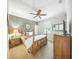 Bedroom with ceiling fan, dresser, and neutral decor at 2308 Bur Oak Ct, Oviedo, FL 32766