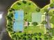 Aerial view of community tennis and basketball courts, offering ample recreational opportunities at 2308 Bur Oak Ct, Oviedo, FL 32766
