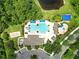 Community pool area with inviting cabanas, recreational features, and ample green space at 2308 Bur Oak Ct, Oviedo, FL 32766