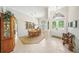 Elegant dining room with chandelier, large front doors, and adjacent living spaces at 2308 Bur Oak Ct, Oviedo, FL 32766