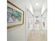 Hallway with carpet and doors with mirrored doors along the right and left side at 2308 Bur Oak Ct, Oviedo, FL 32766