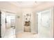 Hallway with views to bathroom, office, and doorway at 2308 Bur Oak Ct, Oviedo, FL 32766